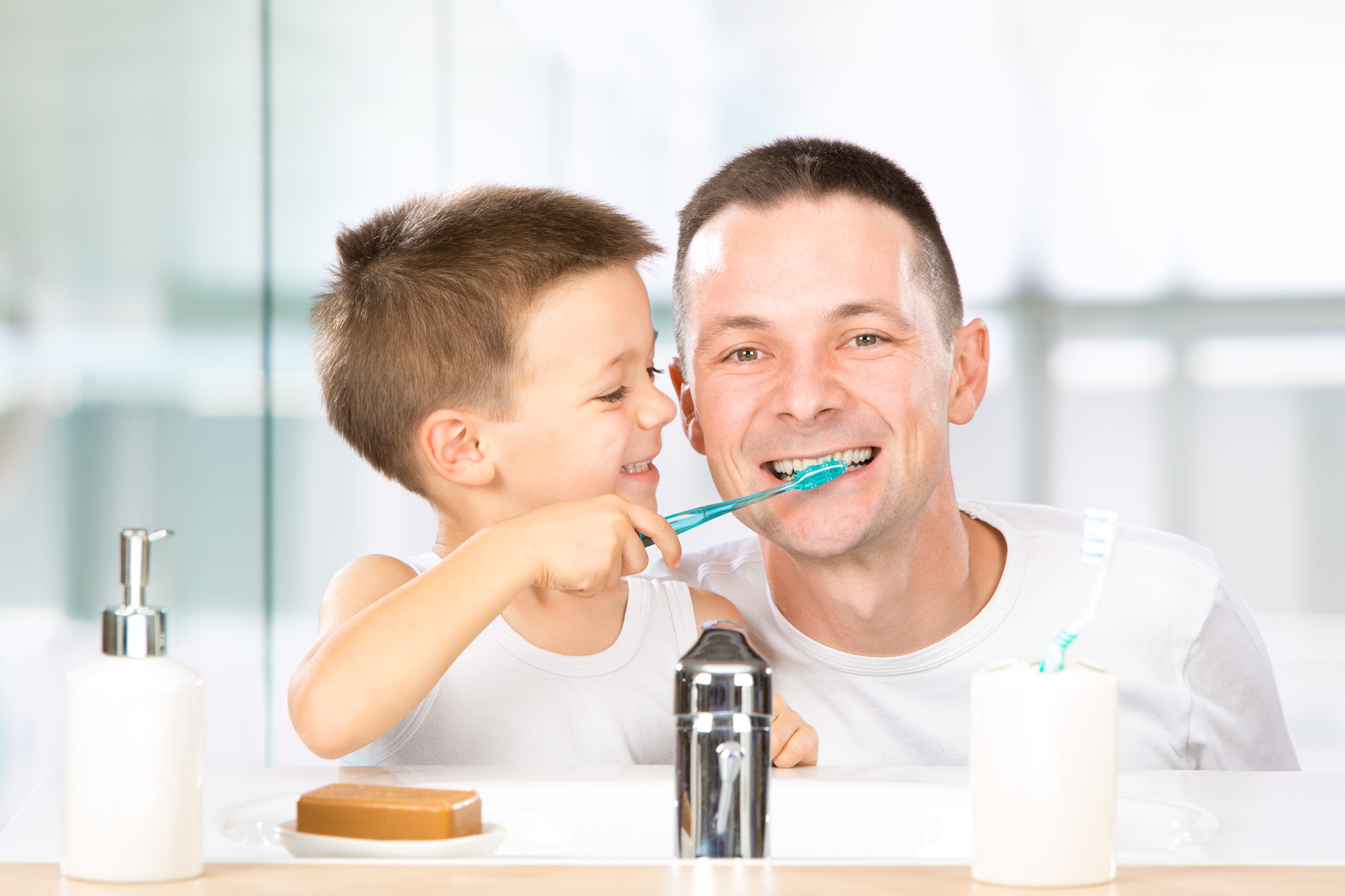 Dentist applying sealants to a patient’s molars for cavity prevention